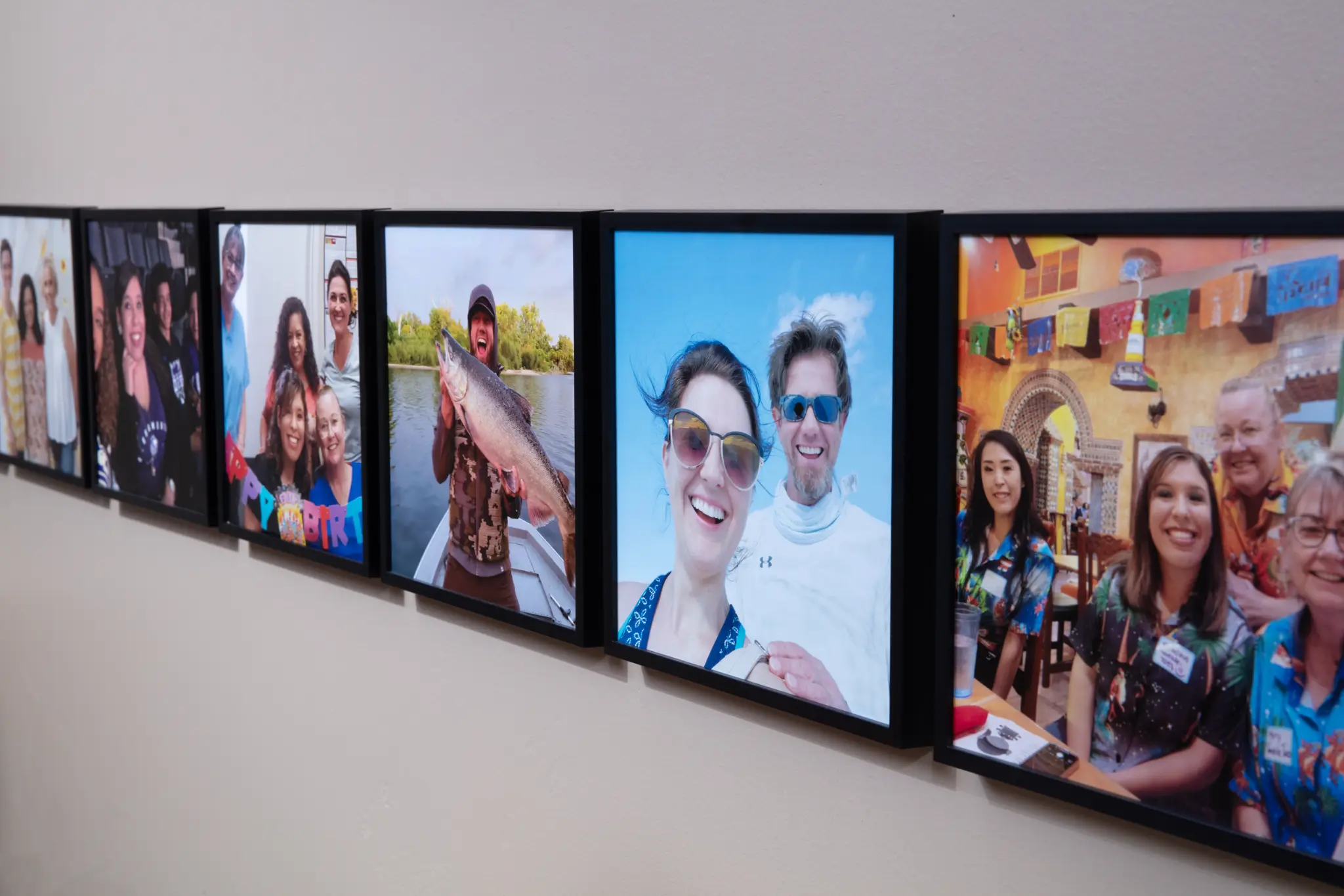 Team photos displayed on the wall